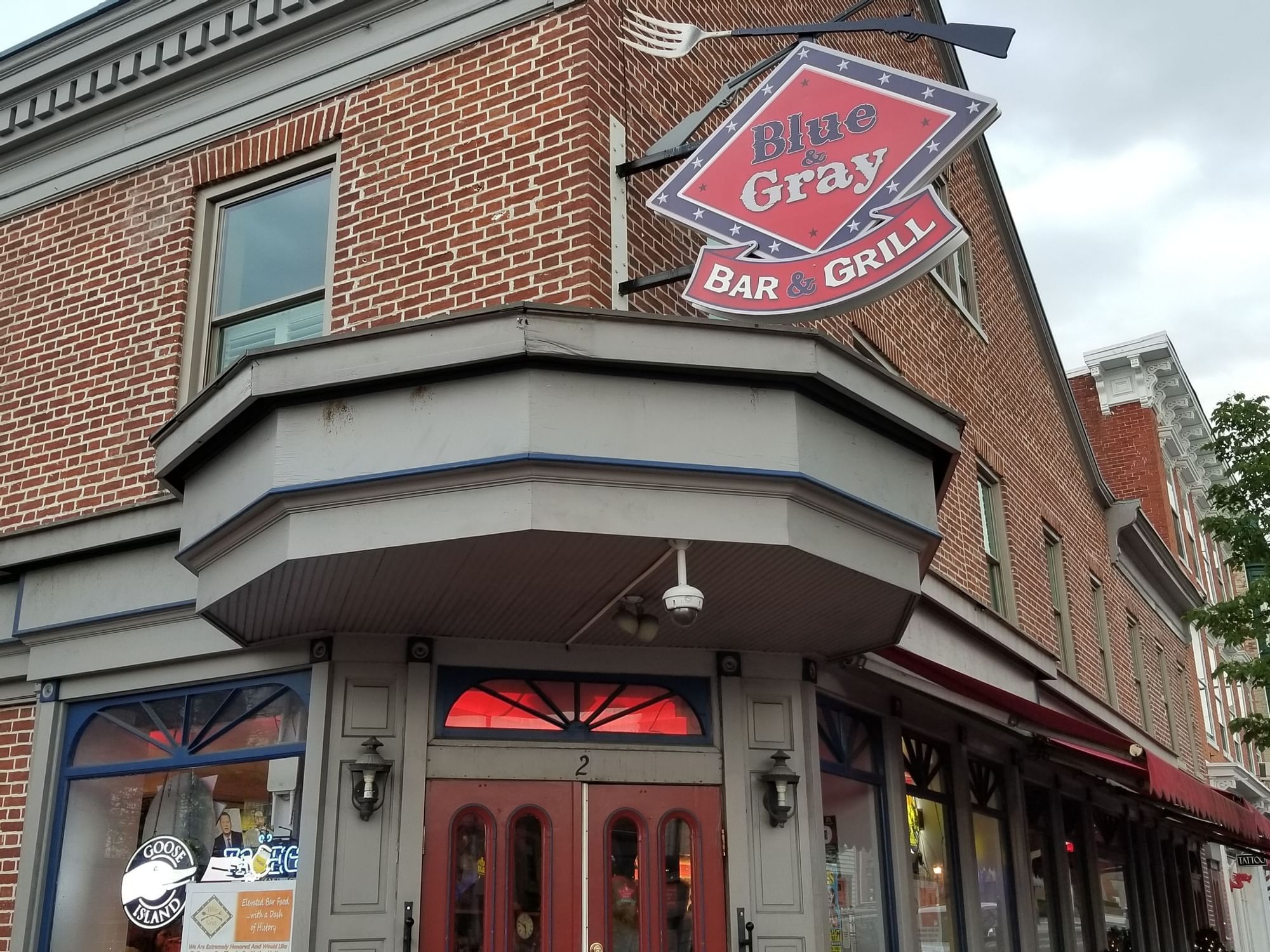 building with sign for blue & gray bar & grill
