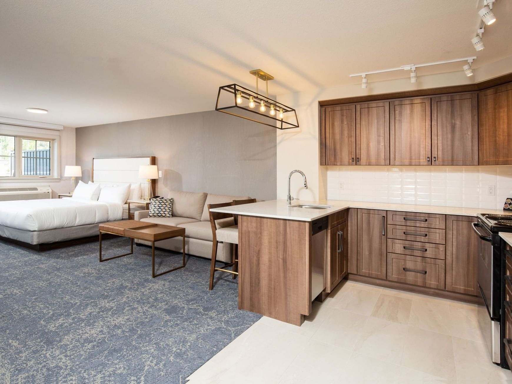 a hotel room with a kitchenette