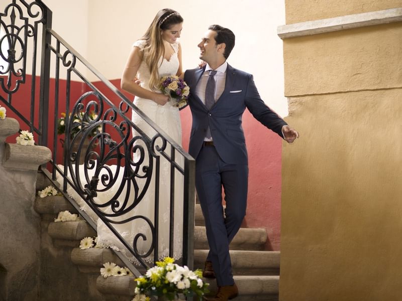 Wedded couple on a stairway at Fiesta Americana Hacienda