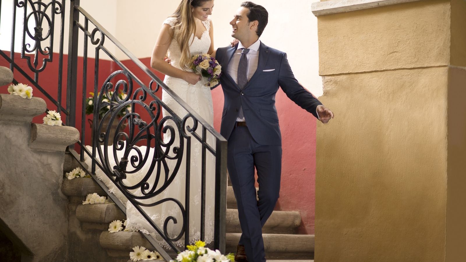 Wedded couple on a stairway at Fiesta Americana Hacienda