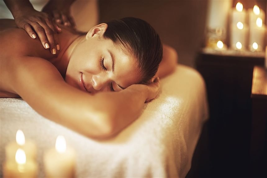 Lady receiving a relaxing body massage in the Accra Beach Hotel, a Caribbean beach hotel with spa and swim-up style bar