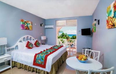 Comfy bed, dining table with balcony in Studio Garden Pool View at Dover Beach Hotel