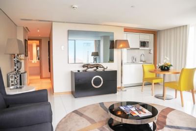 Dining table by living area in Premium Suite at Hotel Presidente Luanda