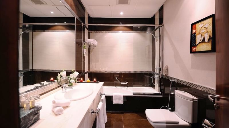 Bathroom vanity & bathtub in Executive Suite at Al Hamra Palace by Warwick Riyadhd