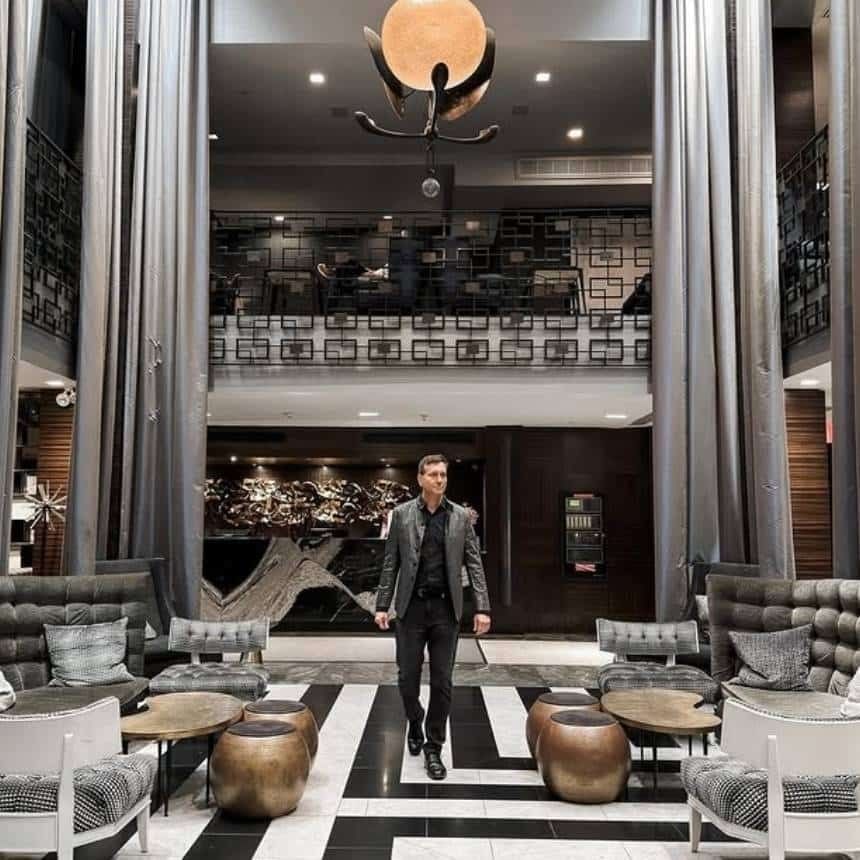 stylish guest in the historic bi-level lobby of the empire
