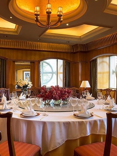 Dining table arranged in Sunshine Room Chinese Restaurant at Celebrity International Grand Hotel
