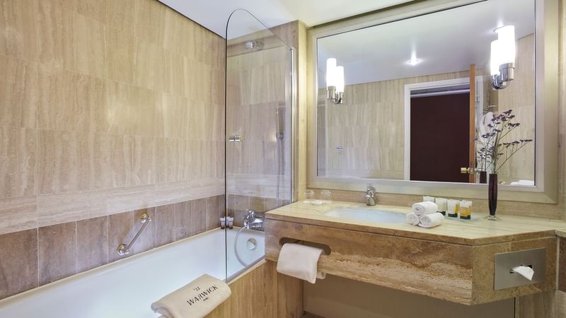 Bathroom in Executive Room with bathtub & vanity area at Warwick Paris Champs Elysées