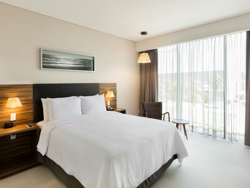 Bright Superior Room, 1 Queen at Fiesta Inn Express Cancún Cumbres with a large window, modern accommodations in Cancún