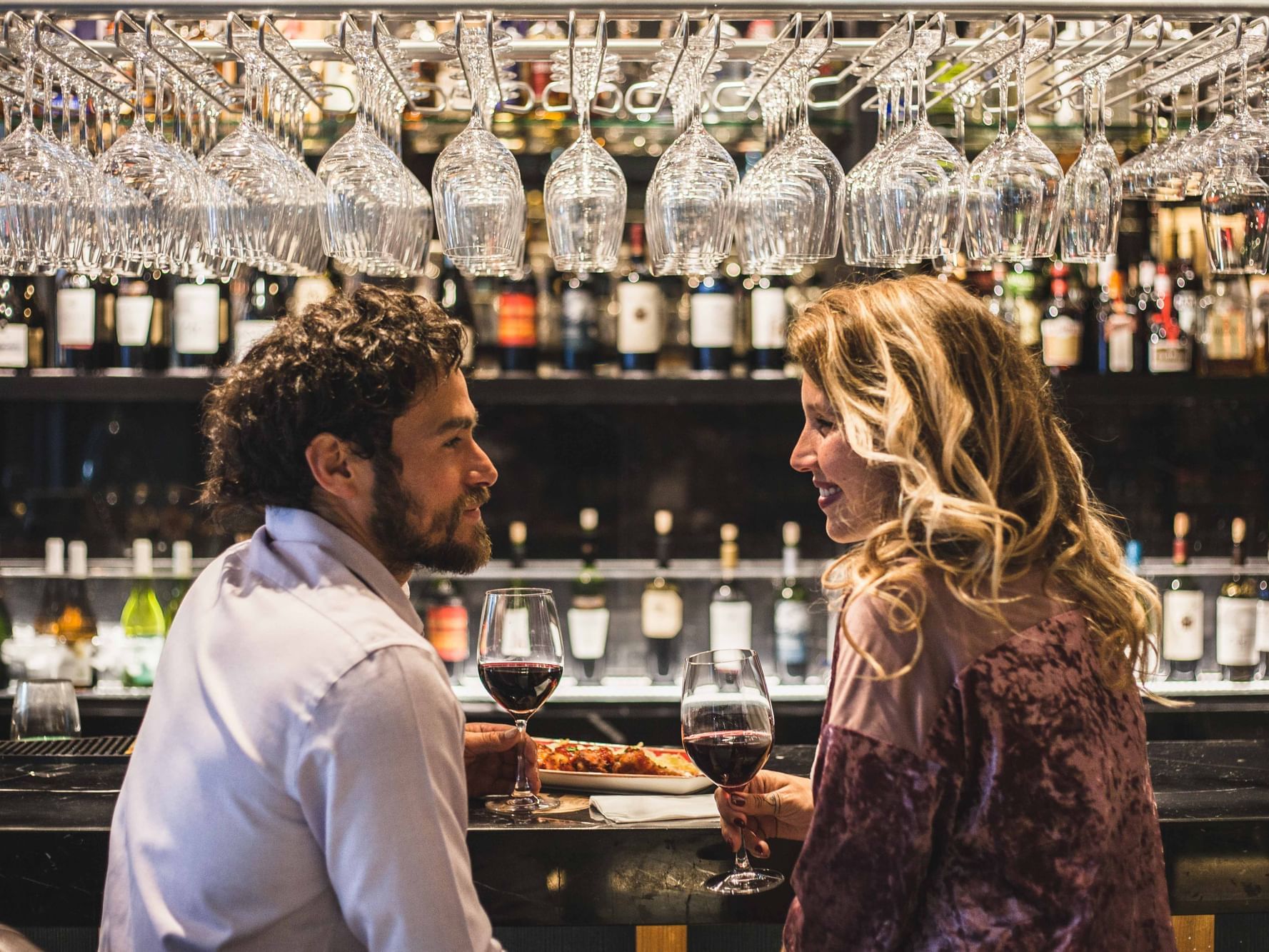 Couple at the Cumbres Lastarria Hotel bar at the beginning of their Romantic Night celebration.