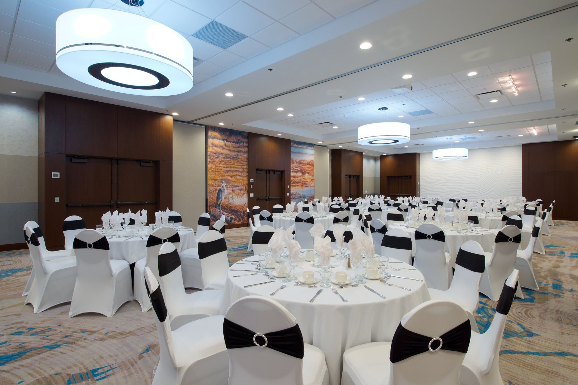 Black and white tables and chairs set up for event