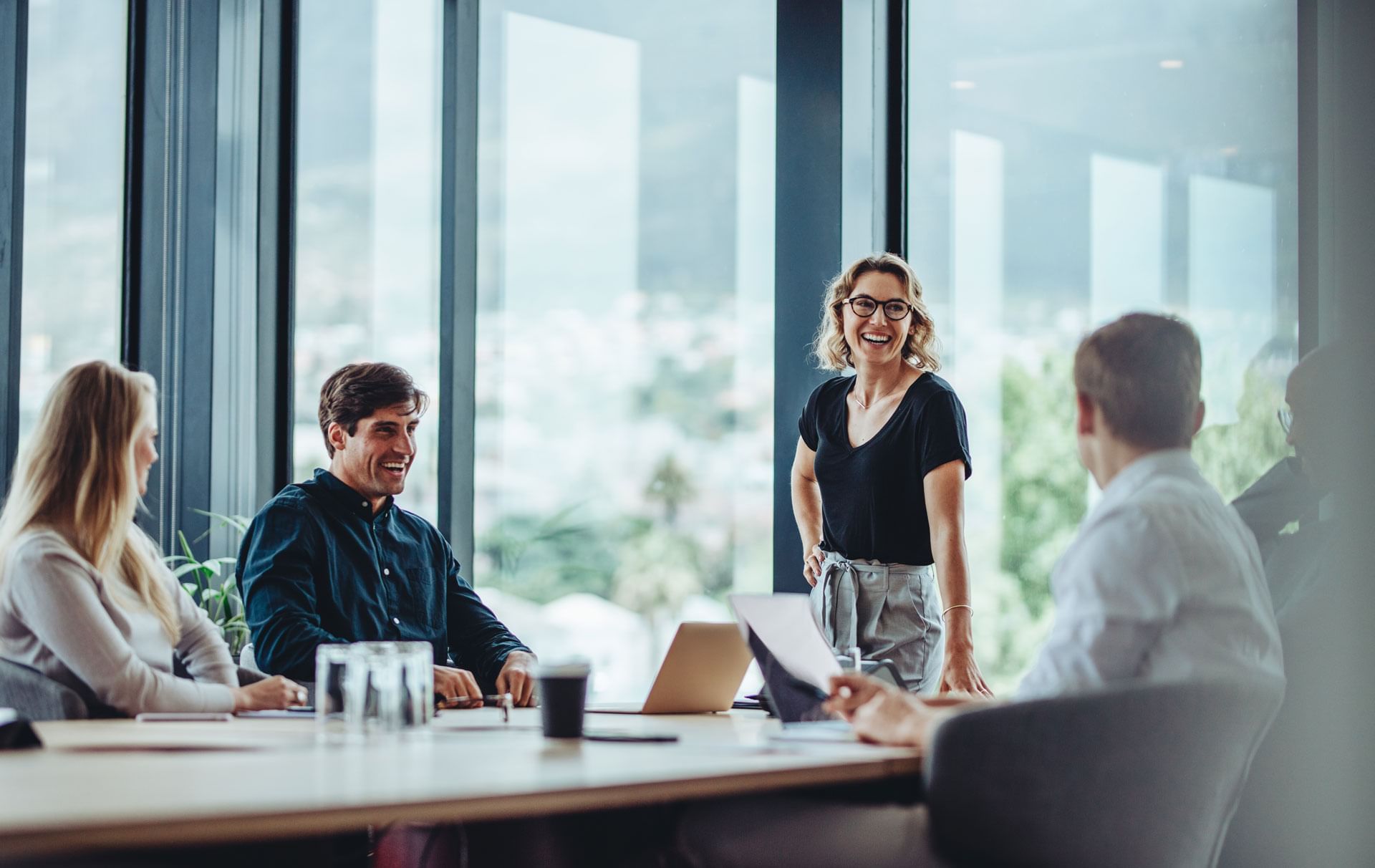 Woman presenting at meeting table