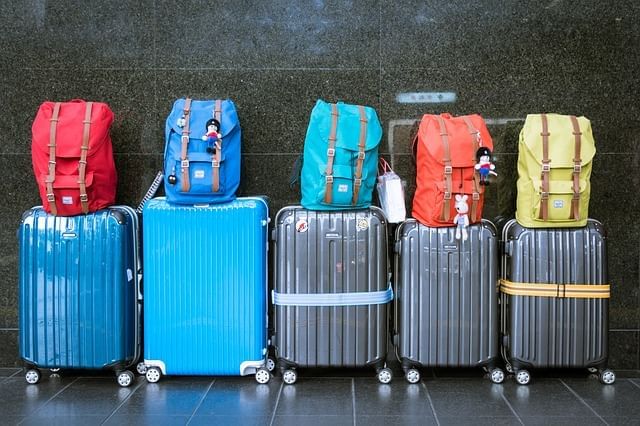 Five suitcases with backpacks at Shop Smart near Lake Buena Vista Resort Village & Spa