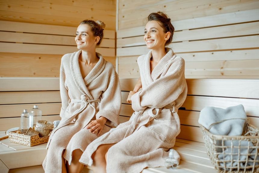 Two ladies with robs relaxing in the sauna at Hotel Brookmere