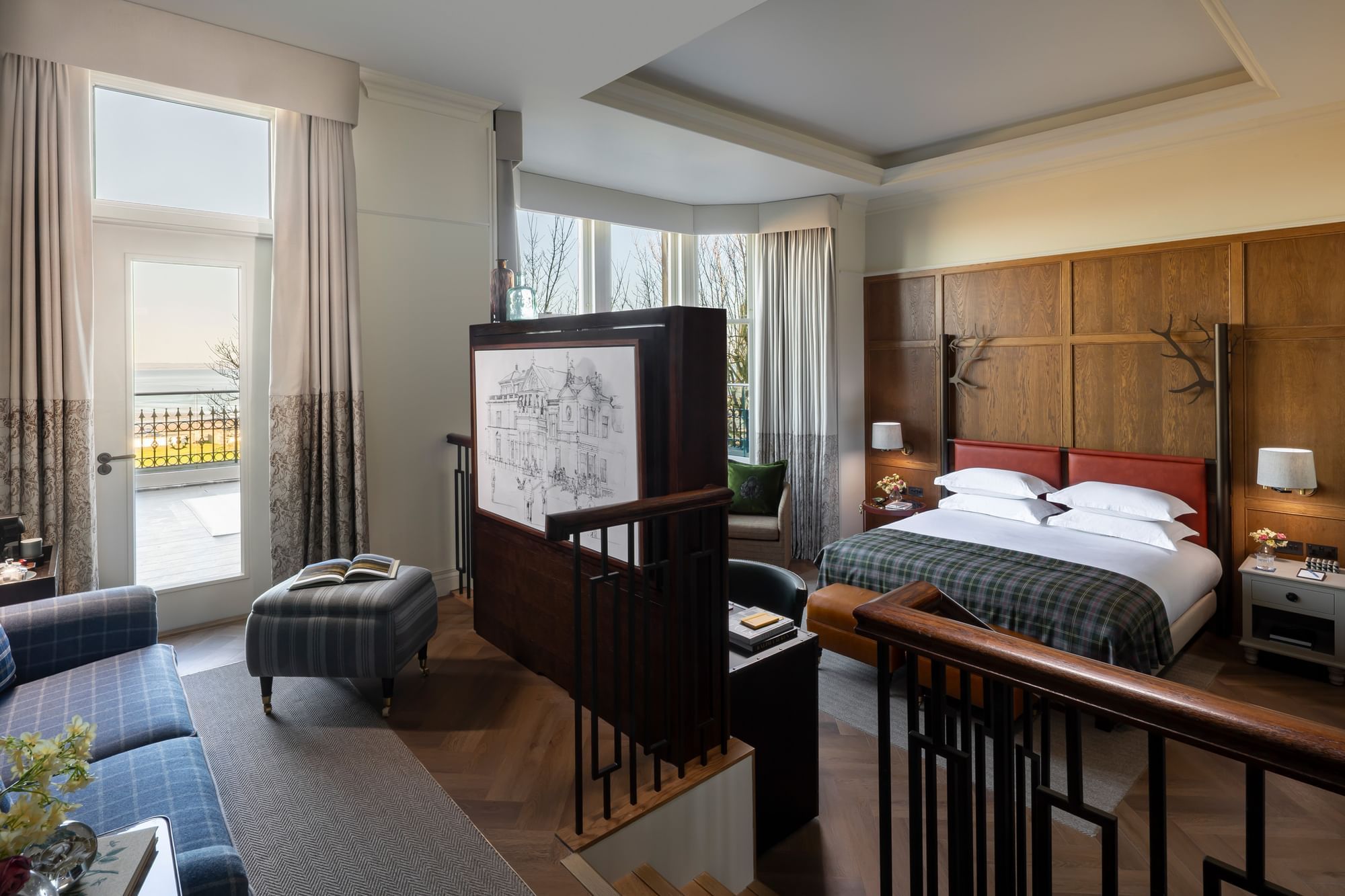 Suite with Sea View & Terrace, featuring a living area with a plaid sofa and a bedroom with a king-sized bed at Seaton House