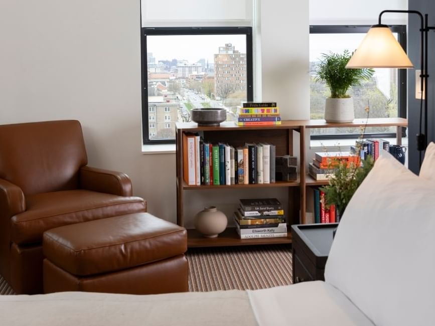 King Study in The Study Hotel at Johns Hopkins, featuring a view, cozy leather lounger and comfy bed