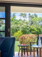 Garden View Room at The Naviti Resort, Korolevu, showcasing outdoor balcony with lush tropical scenery.