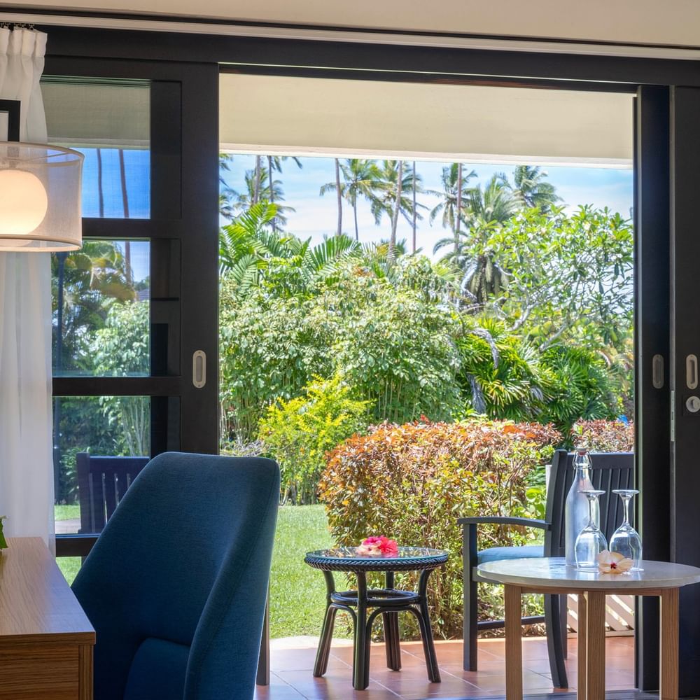 Garden View Room at The Naviti Resort, Korolevu, showcasing outdoor balcony with lush tropical scenery.
