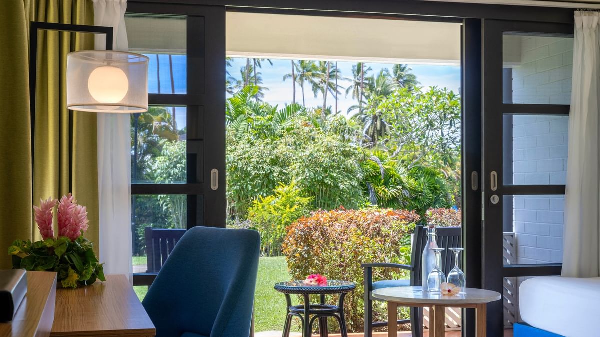 Garden View Room at The Naviti Resort, Korolevu, showcasing outdoor balcony with lush tropical scenery.