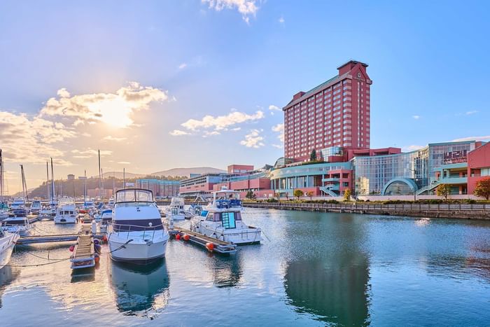 Otaru Marina harbor with boats & hotel exterior view near Grand Park Otaru