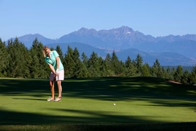 A man playing golf at Alderbrook Resort & Spa