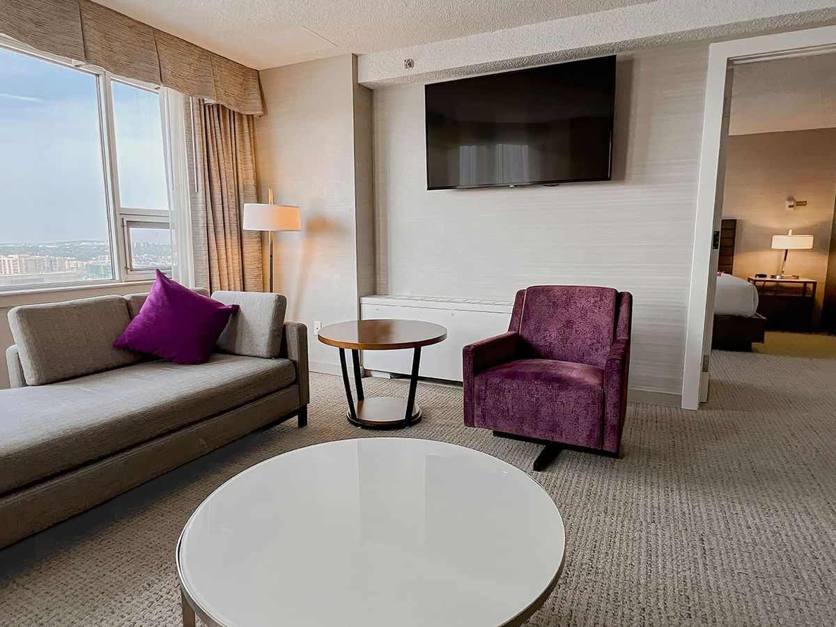 Living area and bedroom of a hotel suite