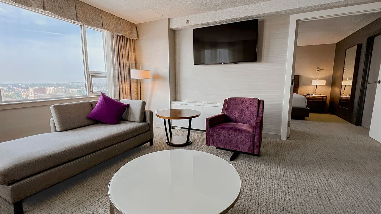 Living area and bedroom of a hotel suite