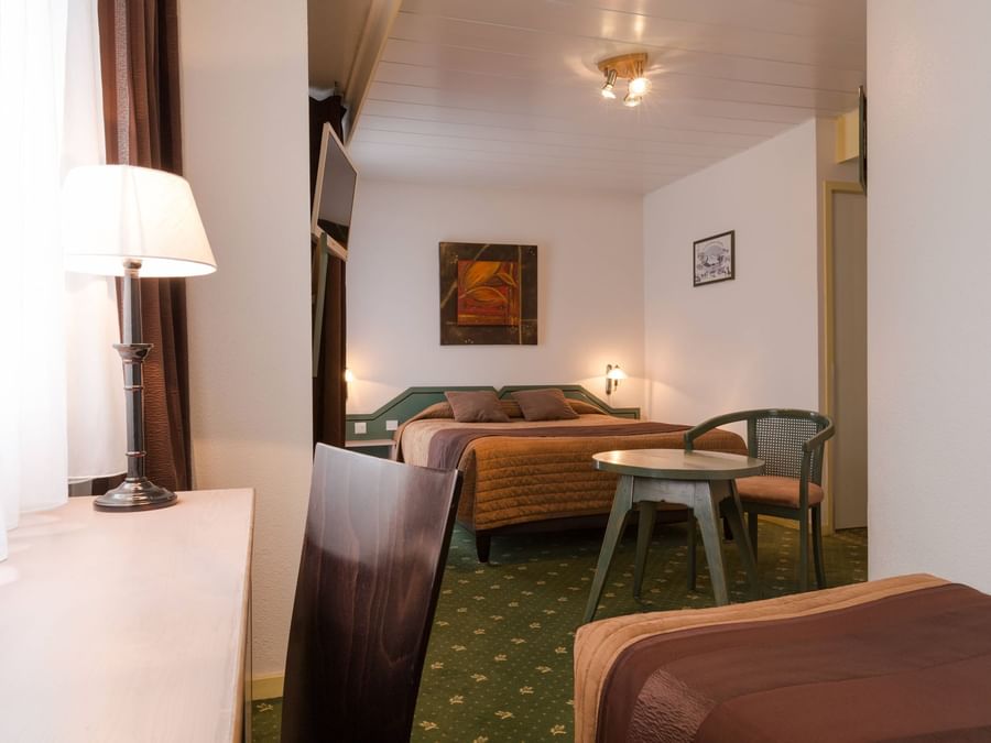 A view of a Triple bed Room at The Originals Hotels
