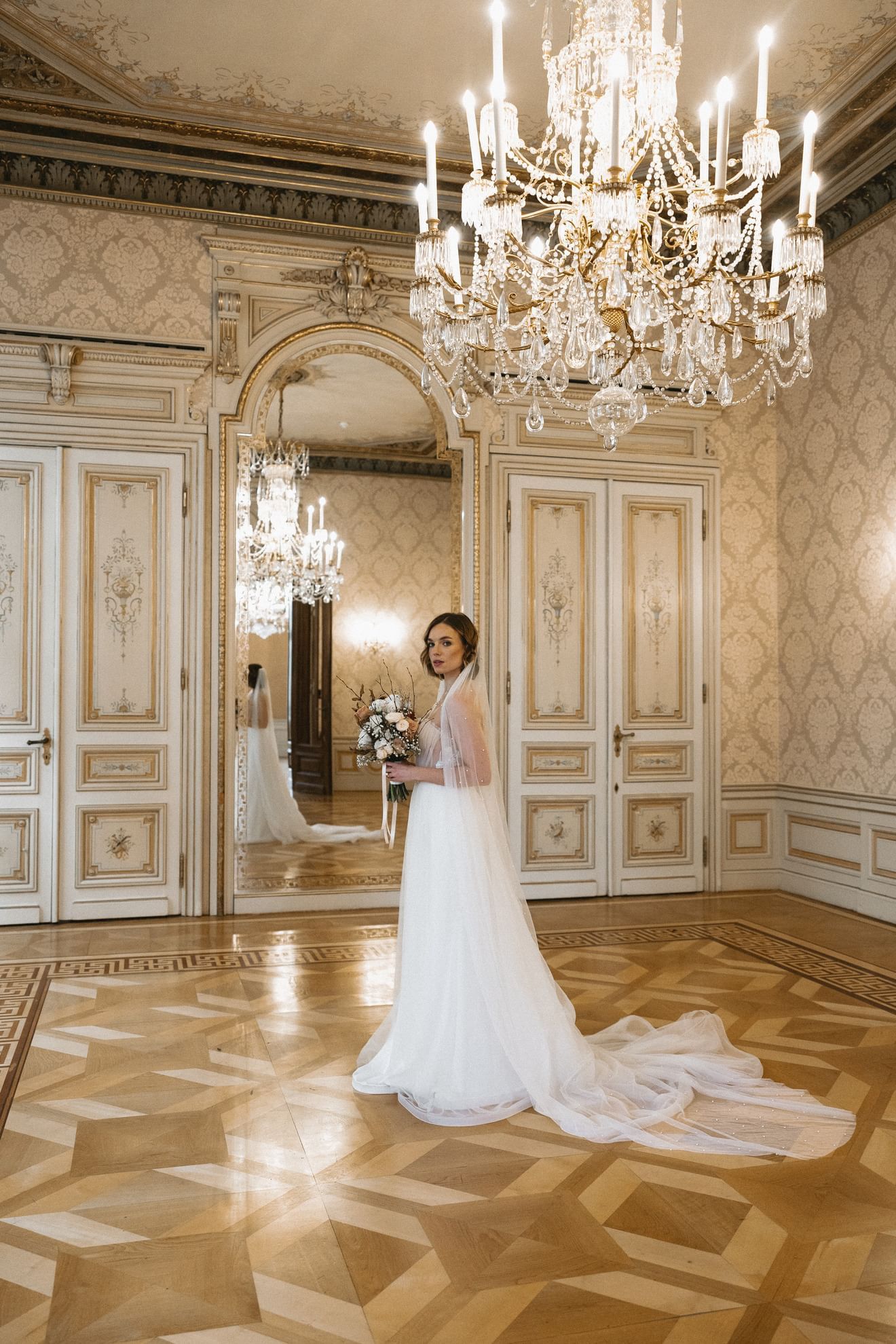 Bride posing by the wedding venue at Almanac Palais Vienna, one of the luxury hotels in Vienna Austria