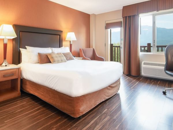 Hotel room with queen bed and a balcony