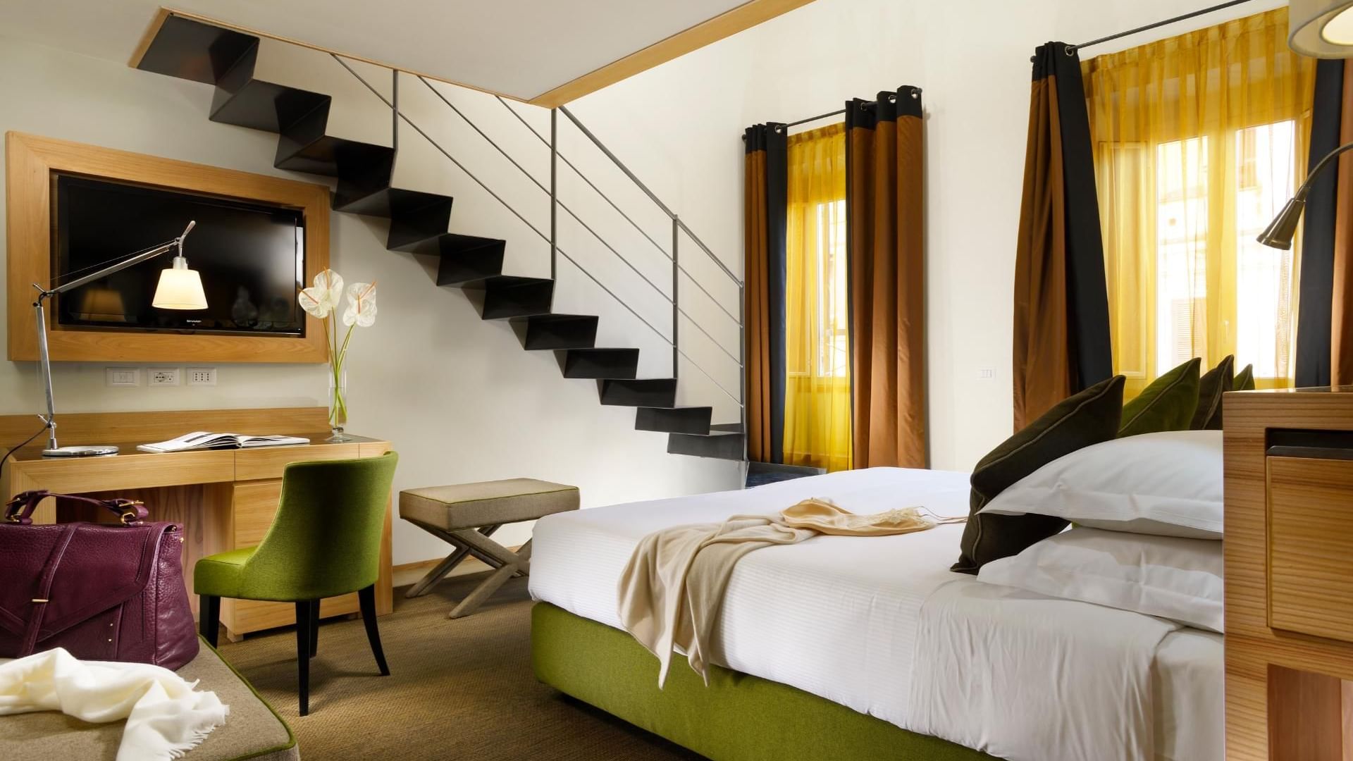 Moncada Suite with bed, working area with staircase at Babuino 181