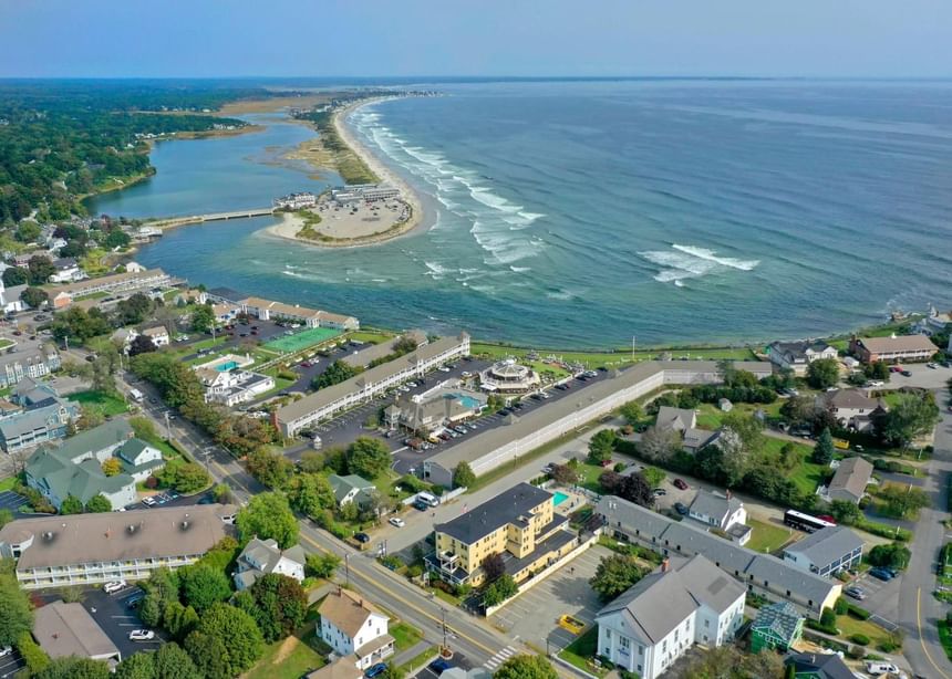 Aerial view of a coastal town with a road separating the beach near Ogunquit Collection