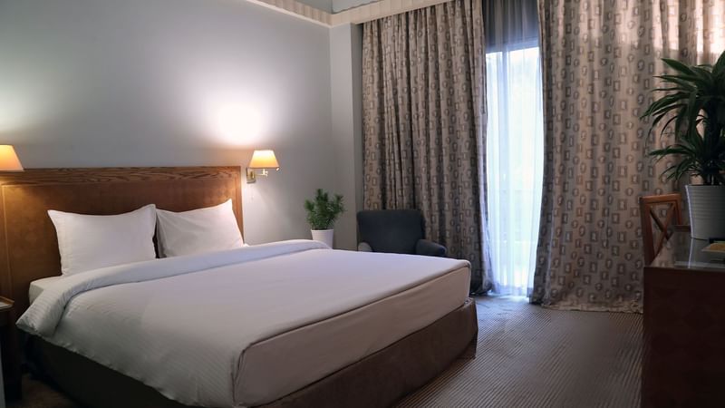 King bed by the window in Classic Room Double at Warwick Palm Beach Hotel - Beirut