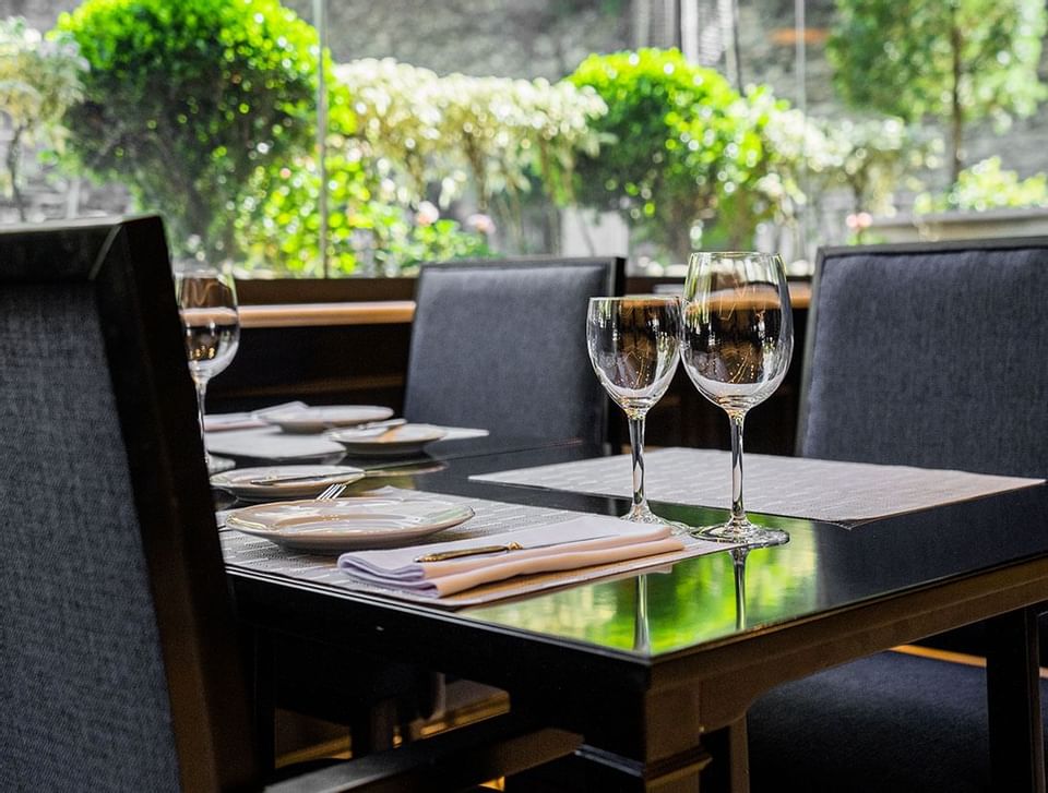 Dining set up with wine glasses at Hotel Emperador Buenos Aires