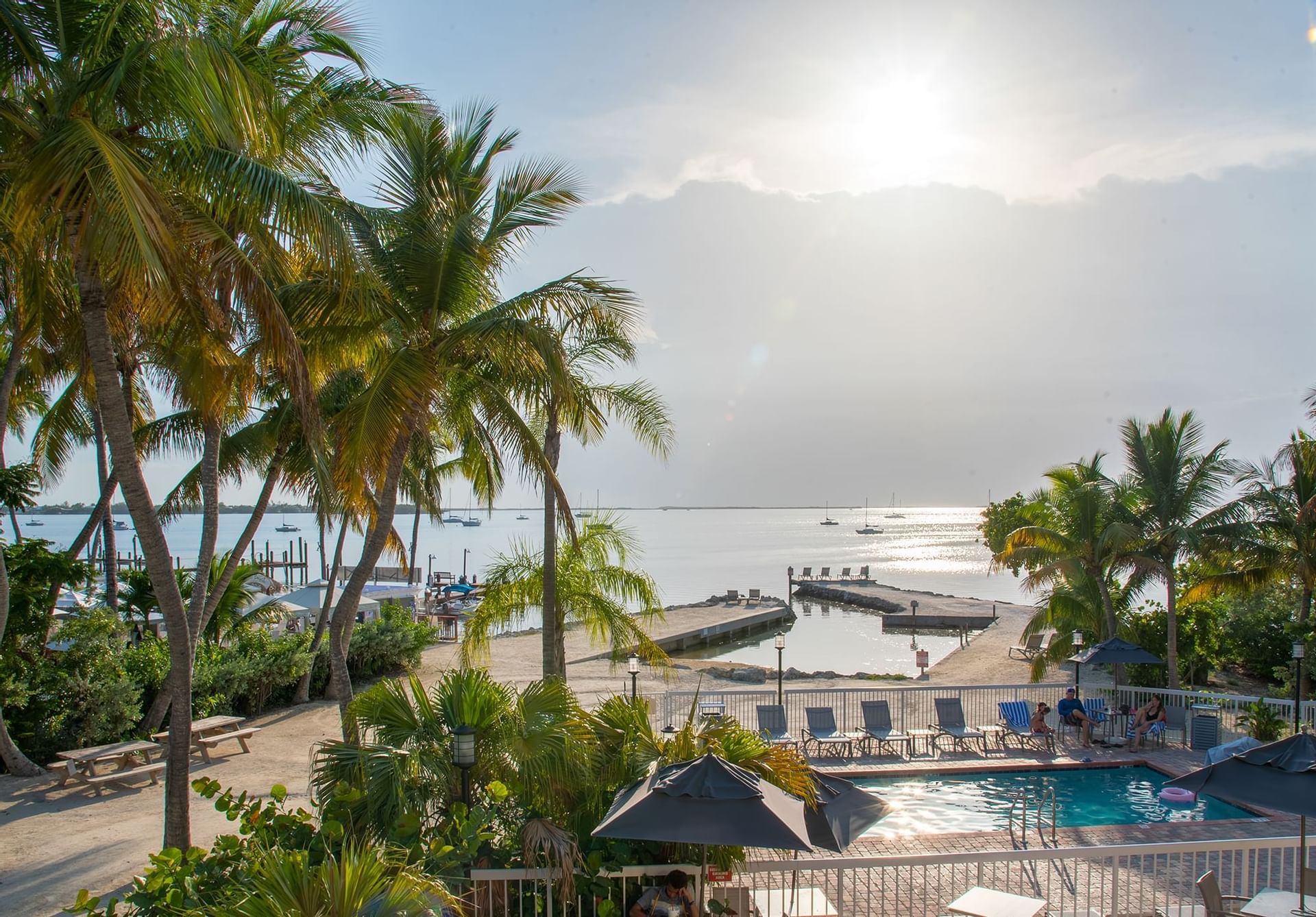 Sunny view overlooking bay and pool.
