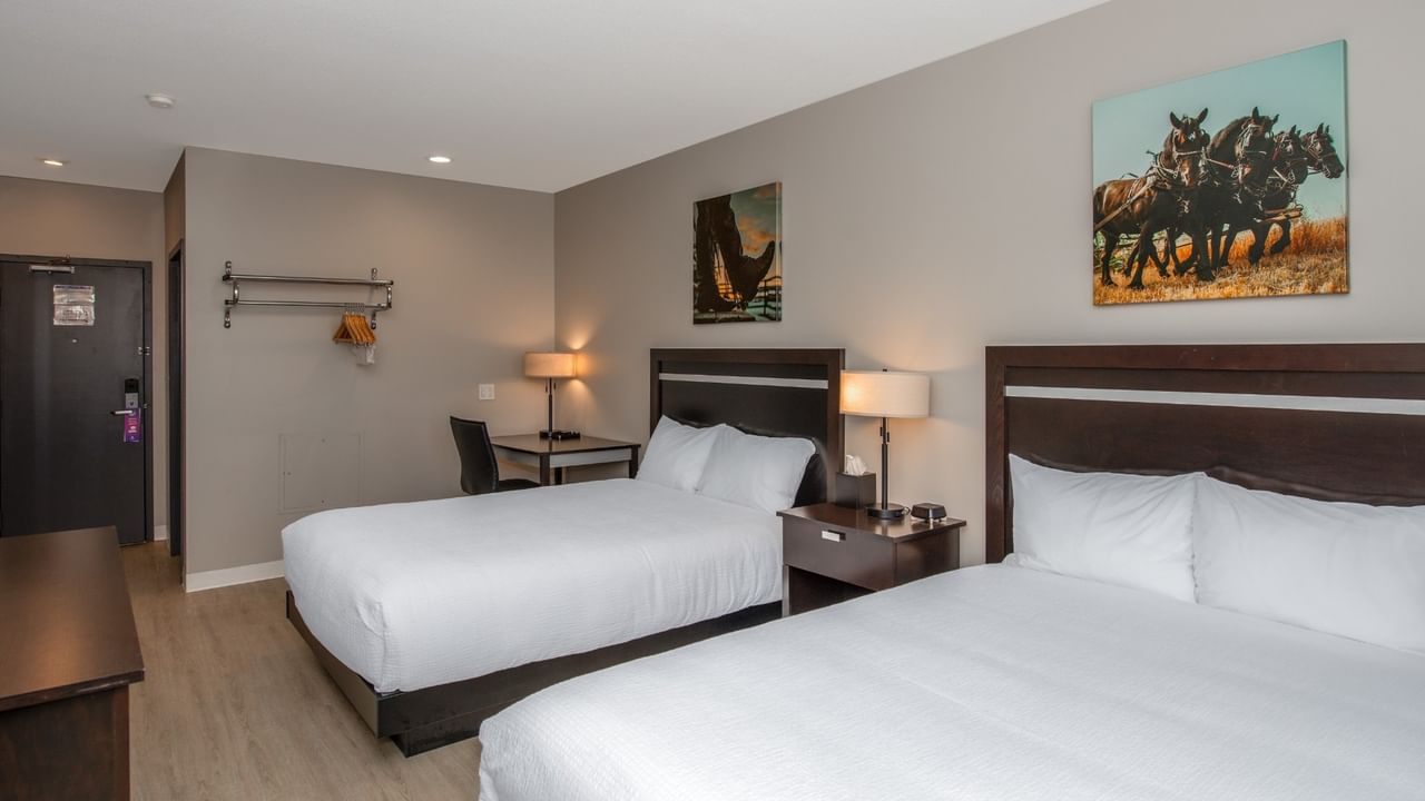 Guest room at Coast Innisfail Hotel with two queen beds