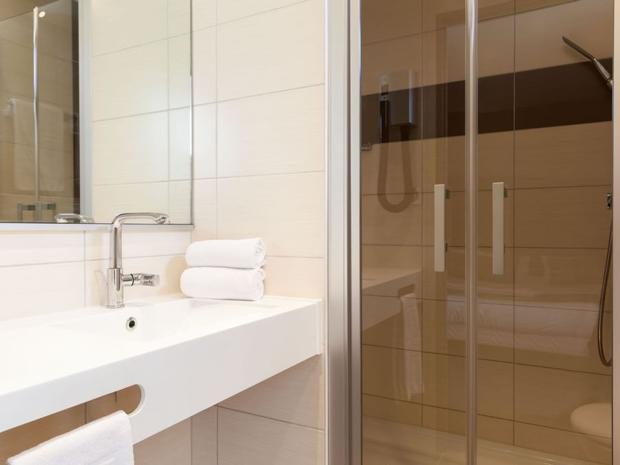 Bathroom vanity in bedrooms at Hotel Arianis
