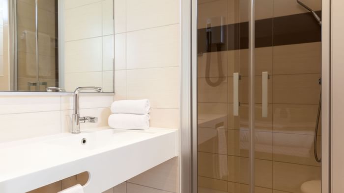 Bathroom vanity in bedrooms at Hotel Arianis