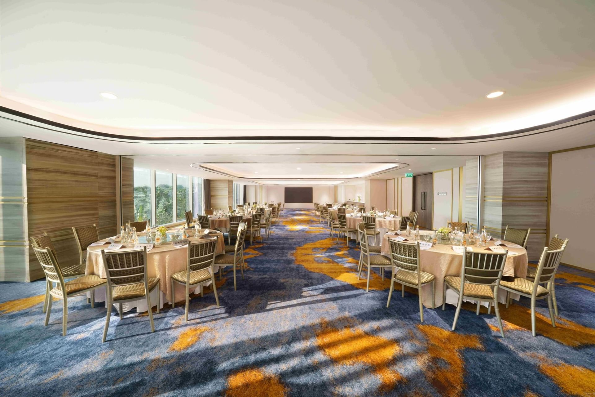 Travel Trade with project screen, round tables and chairs at Vasa Hotel Surabaya
