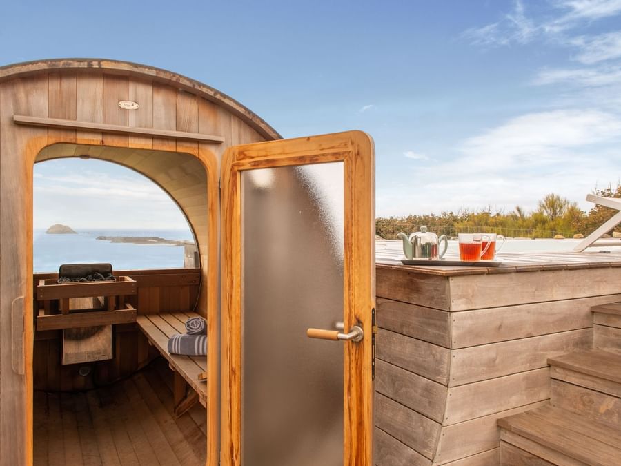 Wooden sauna spa by the sea at The Originals Hotels