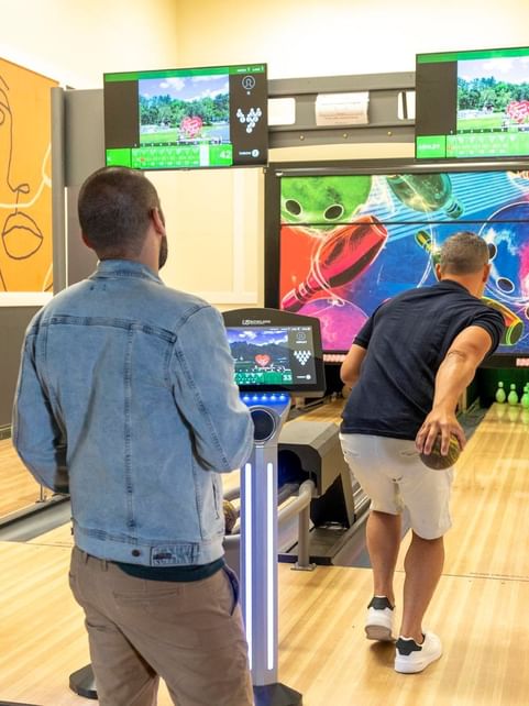 Friends gathered for a Duckpin bowling activity at Cove Pocono Resorts
