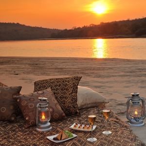 Sandbank Sundowners by the river at Serena Mivumo River Lodge