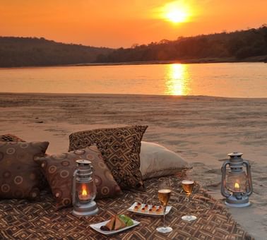 Sandbank Sundowners by the river at Serena Mivumo River Lodge