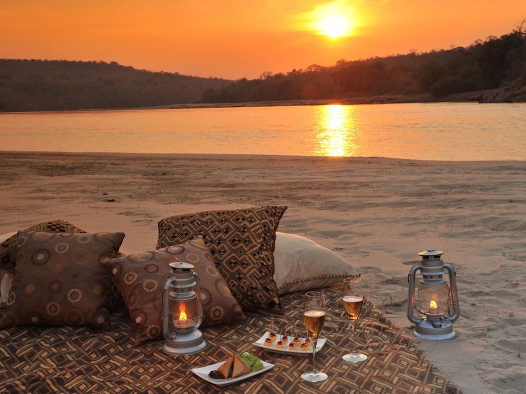 Sandbank Sundowners by the river at Serena Mivumo River Lodge