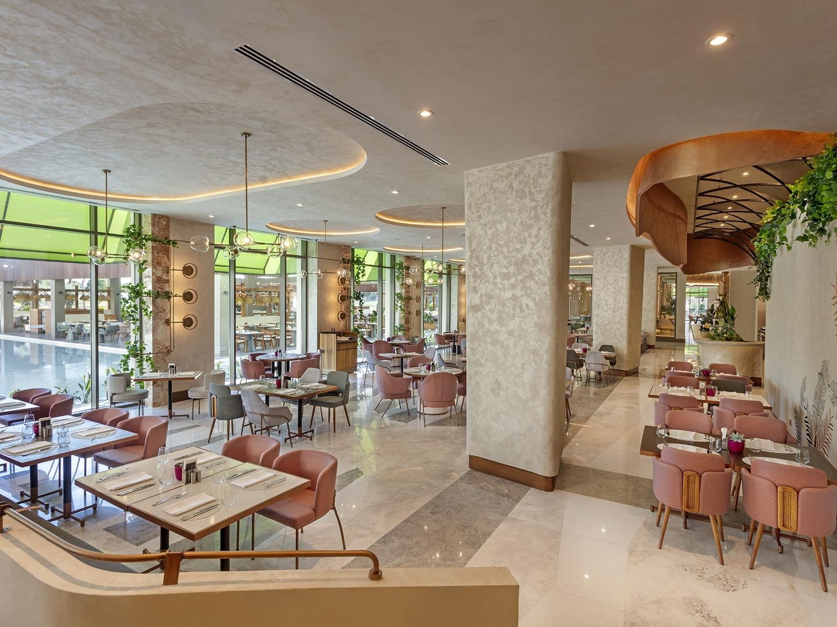 Dining area with marble-tiled floors in Mare Main Restaurant at Cullinan Belek