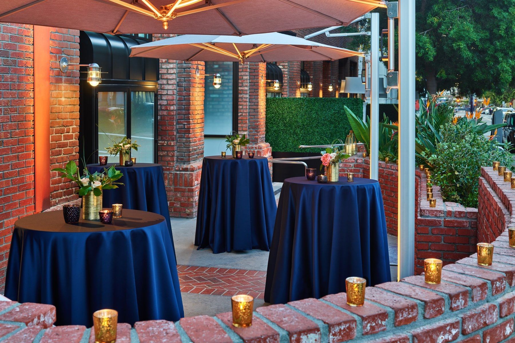 Cocktail tables arranged on a terrace at Hotel Republic San Diego