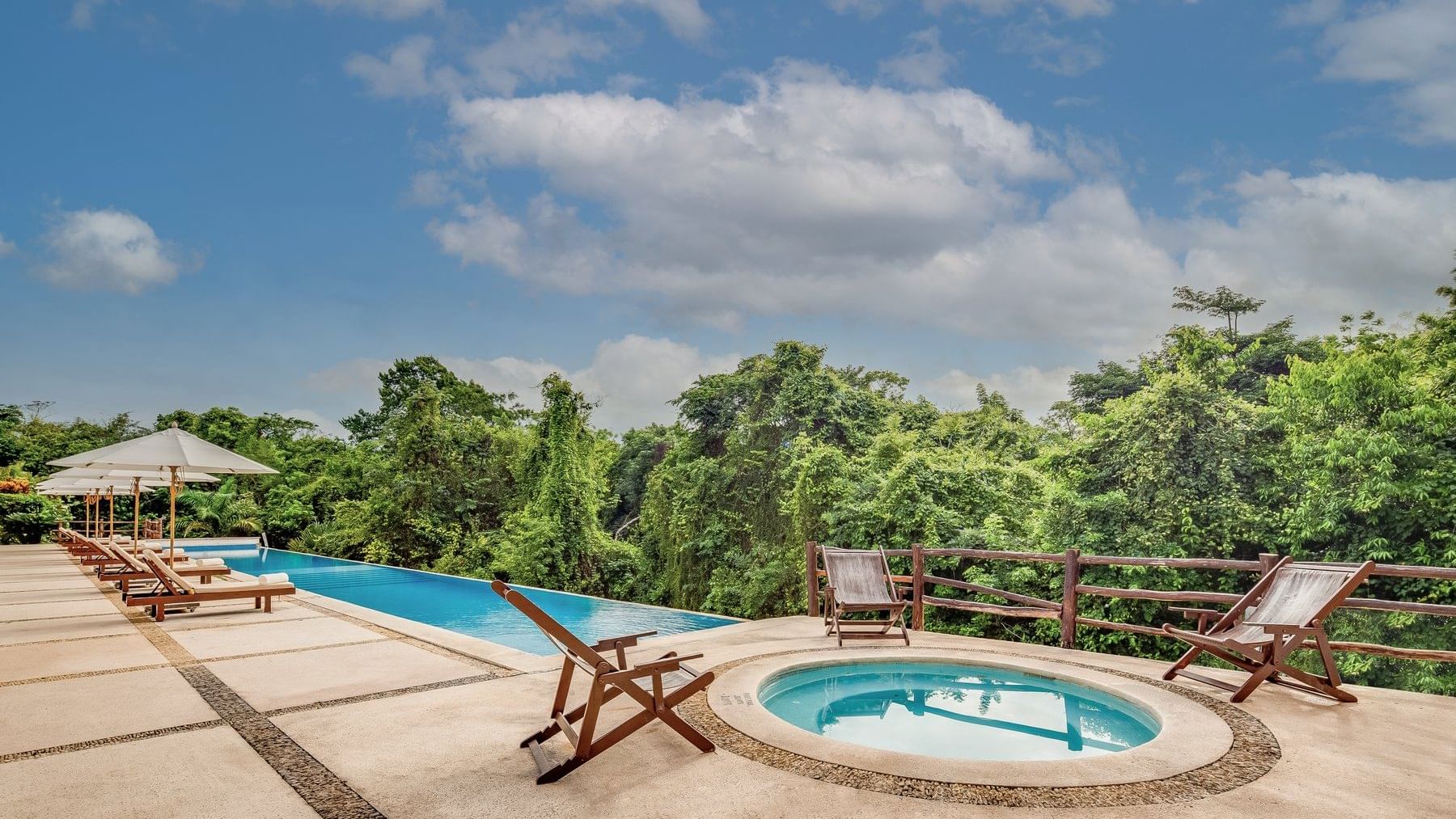 Jacuzzi by the outdoor swimming pool, overlooking the forest at The Explorean Kohunlich