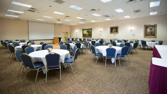 Round banquet tables arranged in a Hall at Music Road Resort