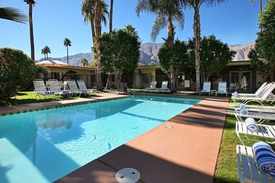 The outdoor pool and lounges at 7 Springs Inn & Suites