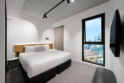 King bed in Executive Two Bedroom Apartment at Nesuto Docklands