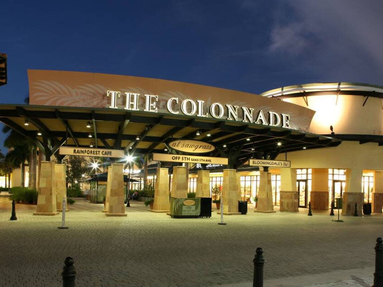Exterior view of the entrance at night in Sawgrass Mills near Ocean Lodge Boca Raton